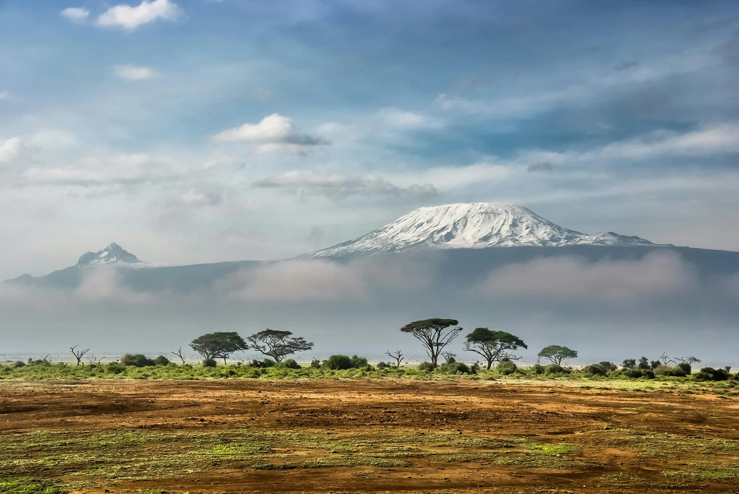 Snow-capped Mount Kilimanjaro towering over the Amboseli savannah